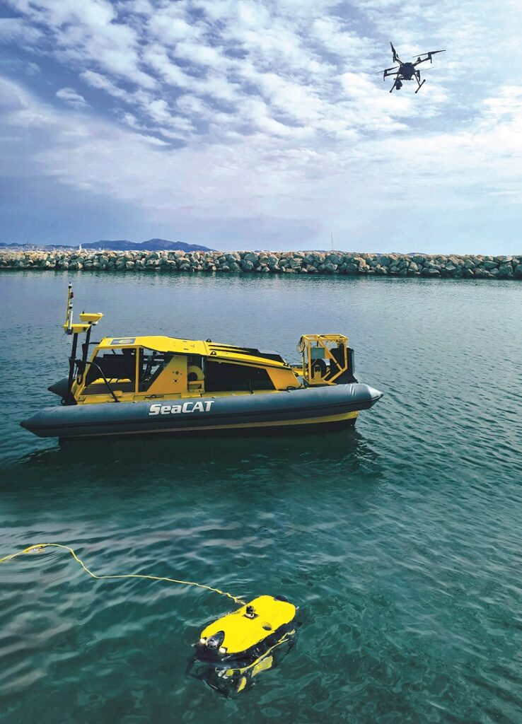 A DJI Matrice 210 flies overhead to provide obstacle avoidance for the USV and spot underwater litter when the water is clear