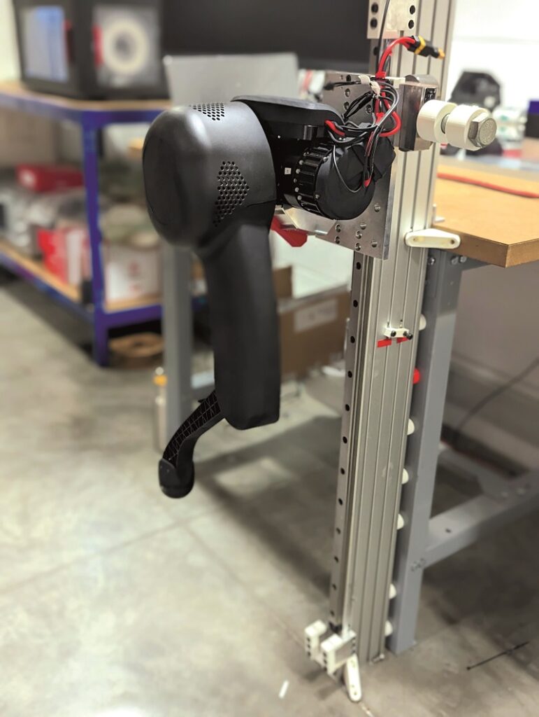 Each actuator contains 35 pieces, and each leg (shown here on a test bench) contains three actuators