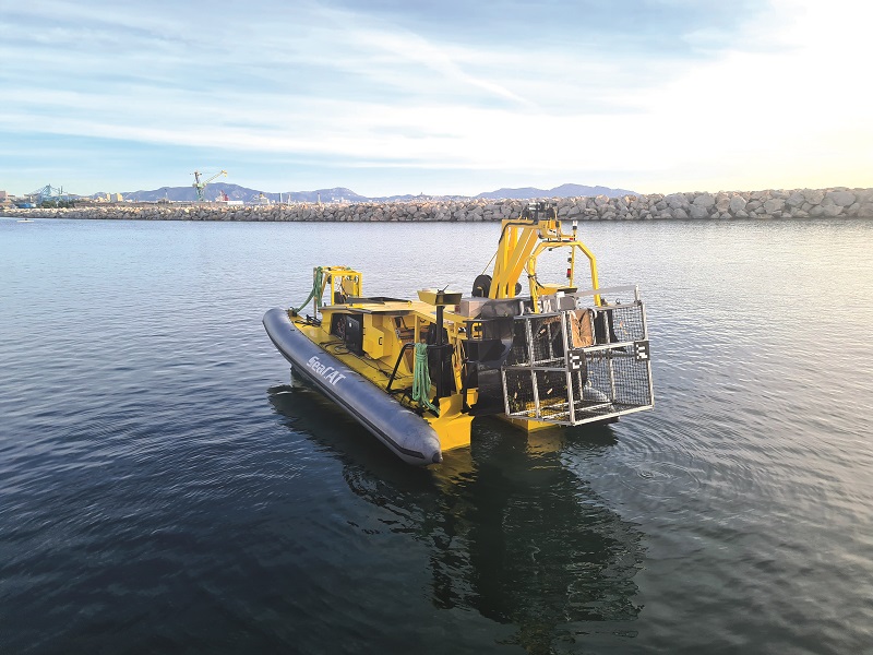 Litter picked by the Tortuga is deposited in a cage deployed on the seafloor by the SeaCAT at the start of operations