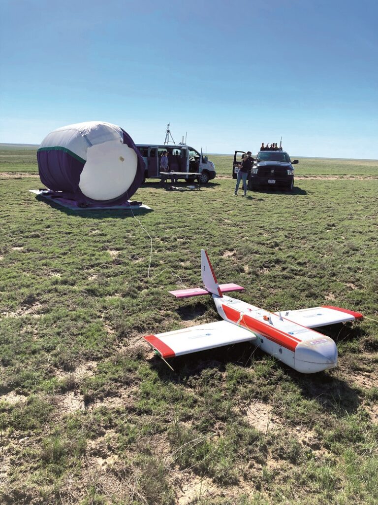 The Horus gas sample return glider being prepared for launch, tethered to the weather balloon that carries it to the top of the atmosphere at around 95,000 ft, where it is released(courtesy of NOAA)