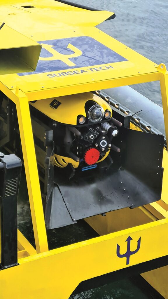 The Tortuga ROV is stowed at the back of the SeaCAT, where the USV lowers or raises it from the water by a winch
