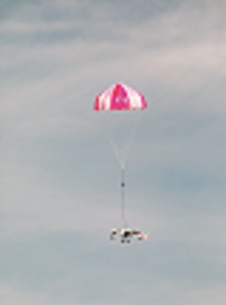 The parachute enables a slow, controlled emergency descent if the landing gear should fail or damage makes standard landings impossible