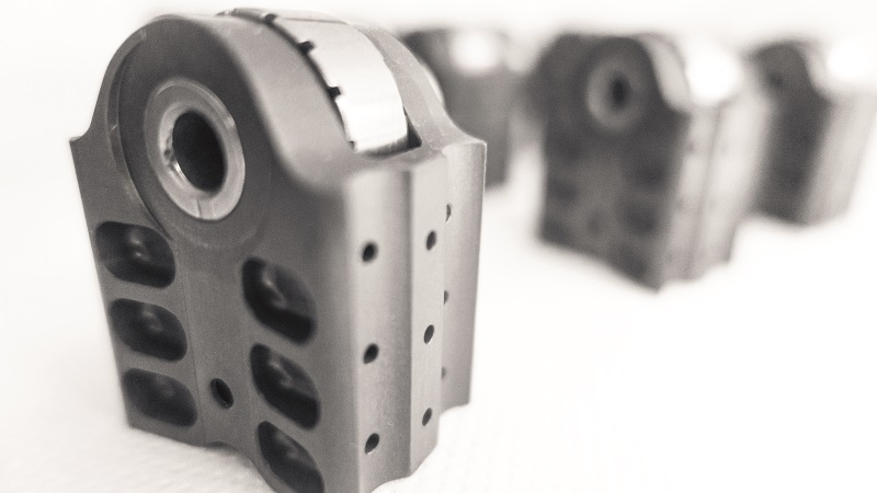 The rods’ BDCs integrate cam followers that run in and actuate the cam track