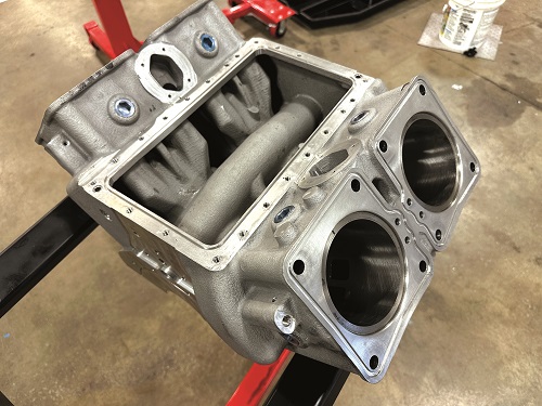 The plenum is integral to the cast aluminium engine block, as are the cylinders