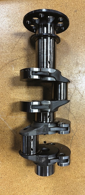 The con-rod’s small end is U-shaped, instead of circular, and bolts on to the gudgeon pin, forcing articulation of the pin and enabling a full-length pin-to-piston bearing surface