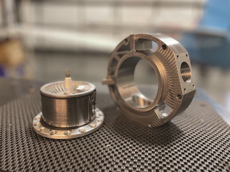 The cylinder head (left) rotates in a stator (right) to open and close the intake and exhaust ports to the combustion chamber