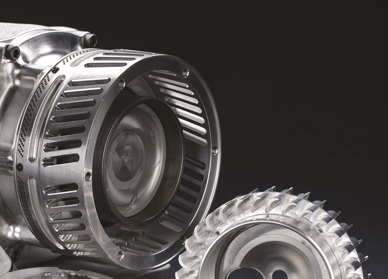 Two sets of concentric fins create a forced-air blowing effect to cool around the combustion chamber