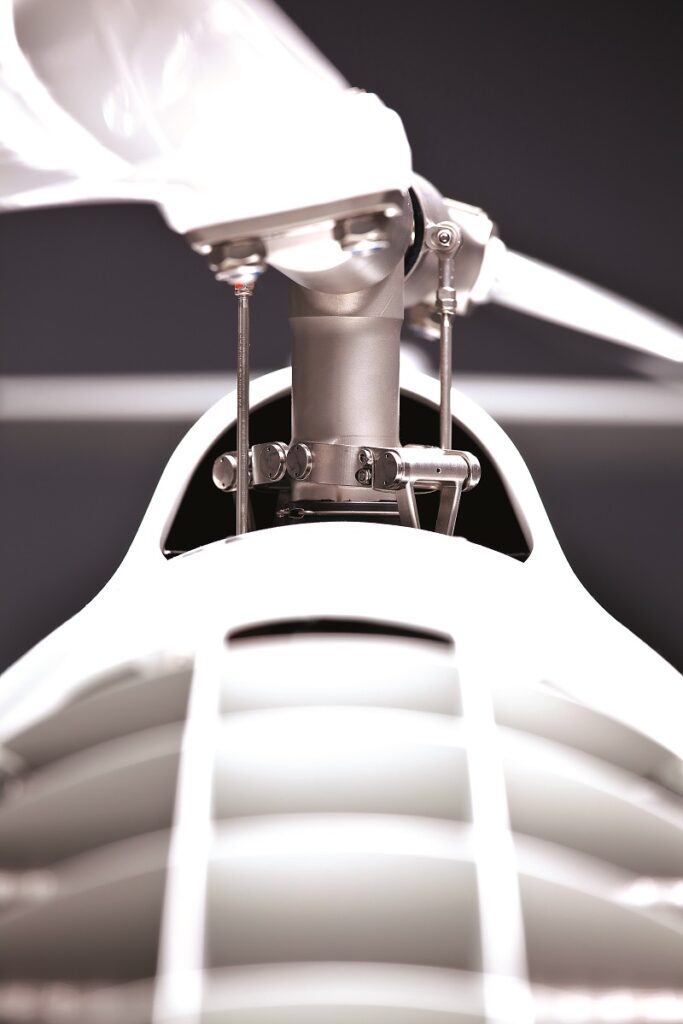 A rigid rotor design is used for the main rotor head, chosen and engineered for stability and robustness against movements in the CoG