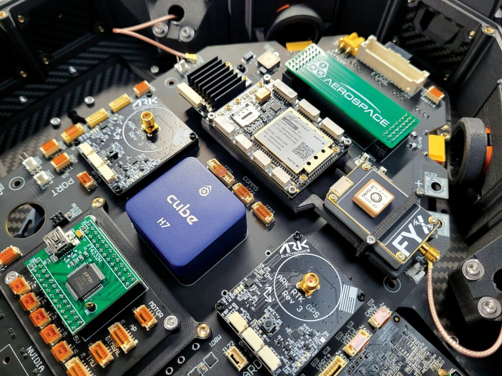 Sensus L’s motherboard with electronics including the Cube autopilot, Microhard data link, and dual RTK GPS modules from ARK Electronics