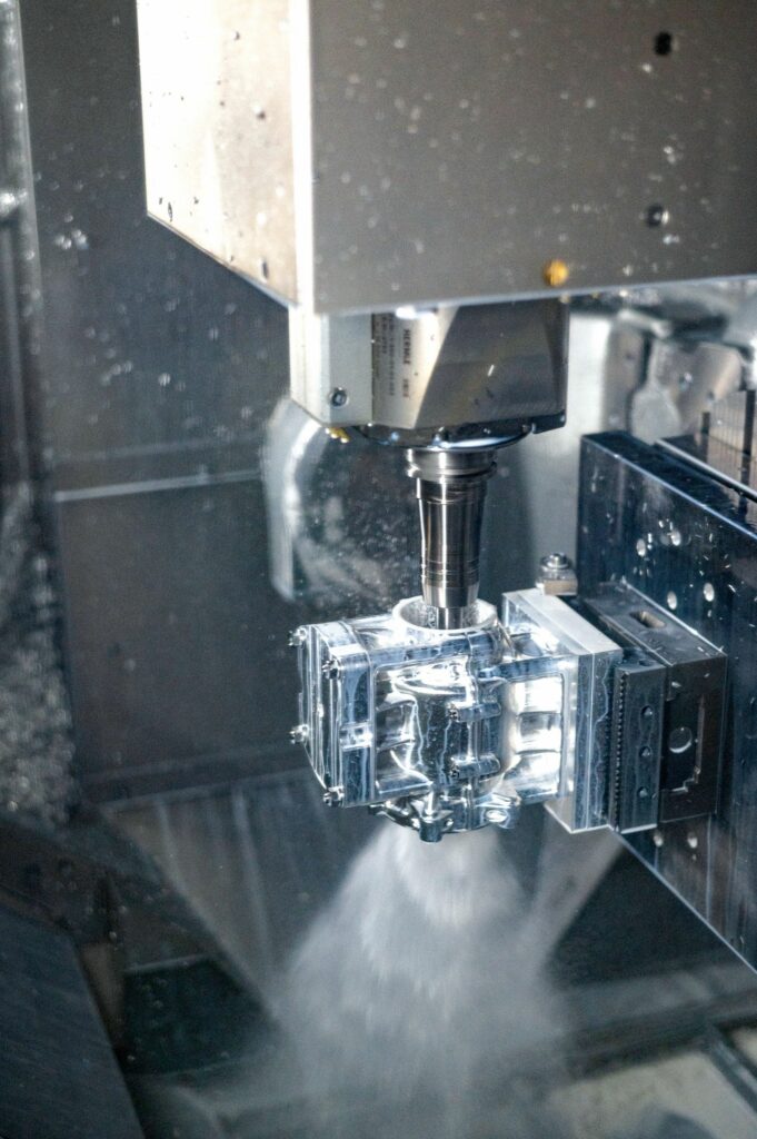 Several five-axis CNC machines, three-axis CNC machines, automatic dual-spindle lathes, a TIG welding robot and an engraving machine