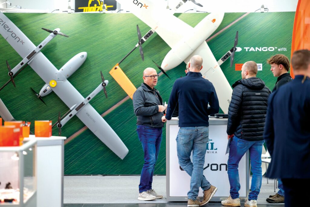The full-electric variant of ElevonX’s Tango UAV (right) has been upgraded with larger wings for longer endurance