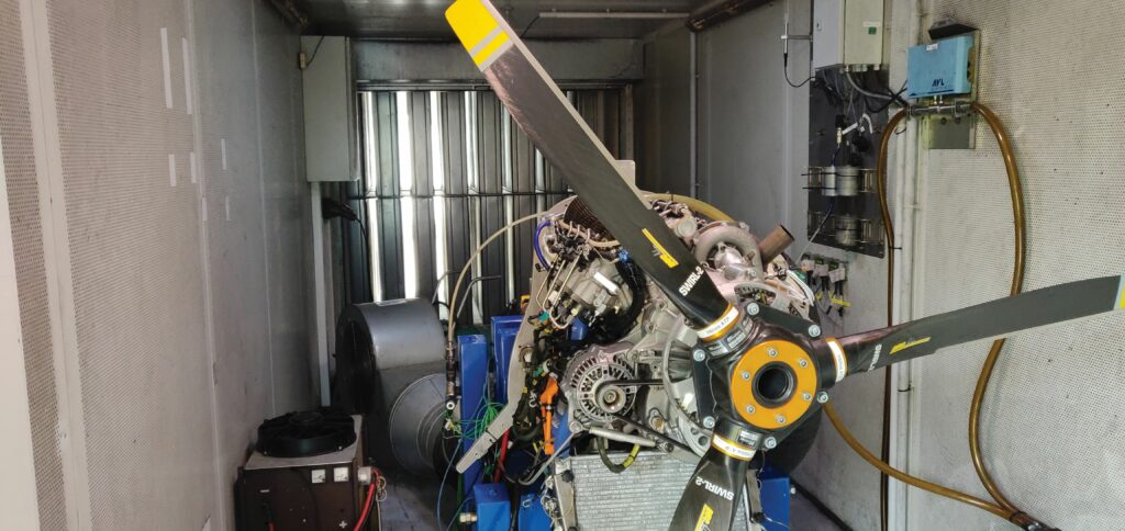 The propeller test cell integrates blowers for simulating ambient air flow, a large rear fan for lowering air pressure, and sensors which track up to 100,000 performance and health data points per second