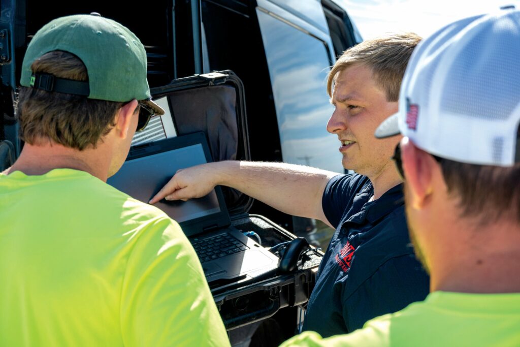 Training was part of the support that the UAS developer provided to PAU. Here, Event 38’s Matthew Wright talks with PAU team members